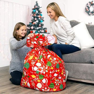 Cree los bolsos plásticos coloridos del papel de regalo para requisitos particulares para el embalaje enorme del presente de Navidad